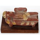 PRE-COLUMBIAN, TERRACOTTA RECLINING FIGURE, H 4 1/2", W 2", D 2"Painted reclining figure on a bed,