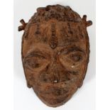 AFRICAN BRONZE HEAD FORM MASK, H 5", W 3"Having wide eyes, braided hair. Brown patina.Heavy brown