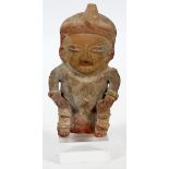 PRE-COLUMBIAN, TERRACOTTA FIGURE, H 5"A seated figure mounted on a clear acrylic base.- For High