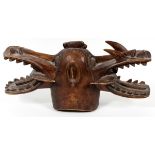 AFRICAN CARVED WOOD 2-HEADED ANIMAL, H 20", W 10"Two headed carved dragon figure with common base.
