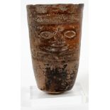 PRE-COLUMBIAN, TERRACOTTA FACE FIGURE VESSEL, H 5"having a round tapered shape with a mask on the