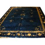 ANTIQUE CHINESE HAND WOVEN WOOL RUG, W 9', L 11' 9"Having a dark blue ground, three borders with the