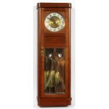 GERMAN WALL CLOCK, H 34", L 11.5"Having a framed beveled glass, full height, hinged access door,