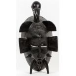 AFRICAN, CARVED WOOD MASK, H 8", W 4"With a bird finial.- For High Resolution Photos visit