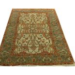 TURKISH, HAND WOVEN WOOL RUG, W 6' 1", L 9' 3"Having a dark beige ground, 3 borders with a primary