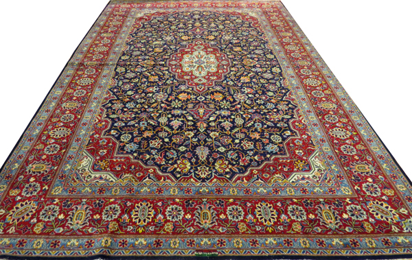 SIGNED PERSIAN TABRIZ, HAND WOVEN WOOL CARPET, W 8' 9", L 12' 4"Having five borders, navy ground