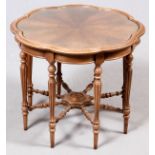 WALNUT OCCASIONAL TABLE, H 20", DIA 24"Sheraton style. Having a fitted contoured glass top, eight