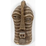 CARVED WOOD MASK, H 19", W 10"having an elongated face, offset eyes, long broad headress passing