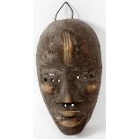 AFRICAN, CARVED WOOD MASK, H 8", W 4"African carved wood mask, having slit eyes and elongated face.-