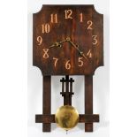 MISSION STYLE OAK WALL CLOCK, H 24", L 13"Having a square shape face with copper Arabic numerals and
