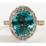 14KT YELLOW GOLD, 6.93CT NATURAL BLUE ZIRCON & 0.90CT DIAMOND RING, SIZE 70.90cts in diamonds