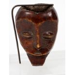 AFRICAN, CARVED WOOD HEAD FIGURE, H 4"having an elongated face with narrow eyes, cavity through