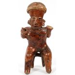 PRE-COLUMBIAN, TERRACOTTA SEATED FIGURE, H 10"Seated on a chair.repair to the neck, GA.- For High