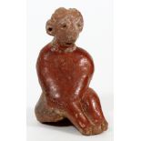 PRE-COLUMBIAN, TERRACOTTA FIGURE, H 2 1/2"Seated female figure with hands on knees. In red tones,