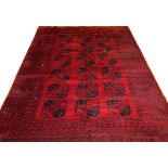 AFGHAN, HAND WOVEN WOOL RUG, W 8' 6", L 11' 6"Having a dark red ground, 5 borders with 18 spaced