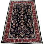 INDO - SAROUK HAND WOVEN WOOL RUG, W 3' 1", L 5'Indo-Sarouk hand woven wool rug having three