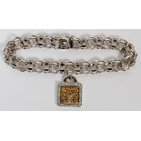 1.00CT DIAMOND, 14KT & 18KT WHITE GOLD CHARM BRACELET, L 8"A 14kt white gold link bracelet with 18