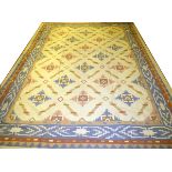 INDIAN DHURRIE HAND WOVEN WOOL RUG, W 8' 10", L 12' 1"Having a cream ground, 5 borders with a blue