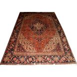 HERIZ PERSIAN WOOL RUG, W 6' 2"", L 9' 2"Having a red ground, five borders, navy corner bracket.