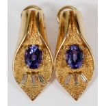 14 KT GOLD TANZANITE & DIAMOND EARRINGS, TW.19 GR. PAIR H 1 3/16'' W 9/16''Oval shaped tanzanites,