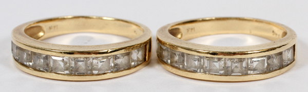 14KT YELLOW GOLD LADY'S WEDDING BANDS, 2Set of two 14kt yellow gold lady's wedding bands. Channel