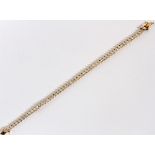 14KT YELLOW GOLD LADY'S TENNIS BRACELETContaining 55 marquee cut cubic zirconia stones. Measuring