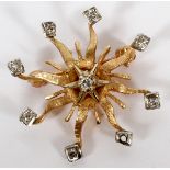 14KT YELLOW GOLD SUNBURST DESIGN BROOCHContaining seven round, brilliant cut diamonds placed on