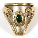 EMERALD 18KT YELLOW AND WHITE GOLD RING, SIZE 6 1/4Having an oval cut emerald accented by mine cut