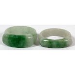 CARVED JADE RINGS, TWOLight green to white in color.Ring sizes 7 1/4 and 7 3/4, approximately.