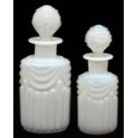 FRENCH OPALESCENT WHITE GLASS COLOGNE BOTTLES, TWO, H 6 3/4"-8"Each is decorated with a swag motif