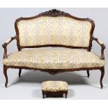FRENCH CARVED WALNUT SETTEE AND FOOTSTOOL H 45", W 55", D 28"The settee, which features shell and