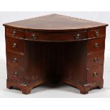 MAHOGANY CORNER DESK, H 30", W 46", D 33"Having inset leather top and a total of 8 drawers, one