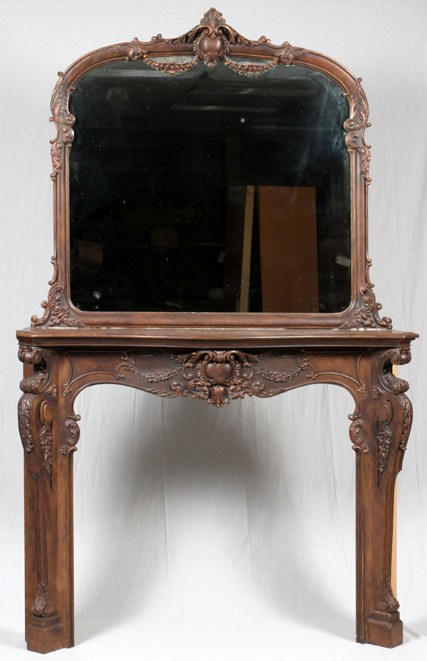 WALNUT MANTLE AND MIRROR, C. 1850Carved swags, scrolls and flowers. Mantle is 50" x 63" x 12.5".