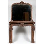 WALNUT MANTLE AND MIRROR, C. 1850Carved swags, scrolls and flowers. Mantle is 50" x 63" x 12.5".