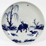 CHINESE PORCELAIN PLAQUE, H 2 1/2", DIA 13"man riding a ox in landscape. Chinese script mark on