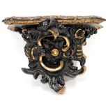 CARVED & PAINTED BLACK GILT BRACKET SHELF, H 10", L 14"A rocailles style ornamented shelf, painted