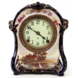 ANSONIA DEMI PORCELAIN MANTEL CLOCK, H 10 1/4", L 8 1/4"Having a cobalt ground with a hand painted