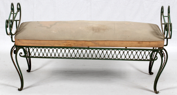 WROUGHT IRON BENCH, H 26", L 48" D 20"Having curved legs and an upholstered seat cushion.The seat is