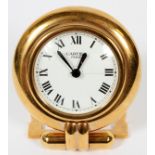 CARTIER TRAVEL CLOCK, L 3 3/4"Cartier travel clock in the shape of a large pocket watch. Having a