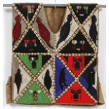 WEST AFRICAN CEREMONIAL BEADED VEST, H 26", L 22"An African beaded ceremonial vest with animal