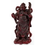 CHINESE CARVED CINNABAR WARRIOR, H 10", L 5 1/2"Full costume and wearing armor, holding a lance.