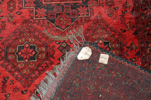 TEKKE BOKHARA WOOL CARPET, W 6' 7", L 9' 8"An overall red ground and design, with gold leaves - Image 2 of 2