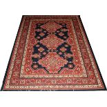 SERAPI STYLE RUG, W 6' 6", L 9' 1"A machine made rug in the Serapi style, having 8 borders, navy and