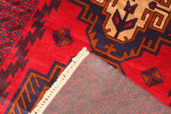 PERSIAN LURI WOOL RUG, C. 1950-1980, W 3' 5", L 6' 7"Red ground with 3 large geometric medallions. - Image 2 of 2