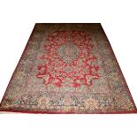 KERMAN PERSIAN WOOL RUG, W 8' 10", L 13' 8"Circa 1920, fine weave, red field.Nice condition.- For