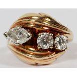 DIAMOND & 14KT YELLOW GOLD RING, SIZE 5 1/4Having two round cut diamonds and a marquise cut