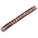 LADY'S DIAMOND & RUBY LINK BRACELET, PLATINUM, GOLD CIRCA 1940Ladies link bracelet containing 67%