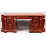 CARVED MAHOGANY PARTNERS DESK, H 33", L 85", D 38"Having leaf and scrolling designs with brass