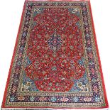 SAROUK PERSIAN RUG, 6' 7" X 4' 3"Red ground with central medallion, multiple borders.Good condition.