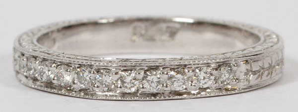 PLATINUM AND 0.36CT DIAMOND BAND, SIZE 8An Edwardian style platinum band set with 0.36ct diamonds.